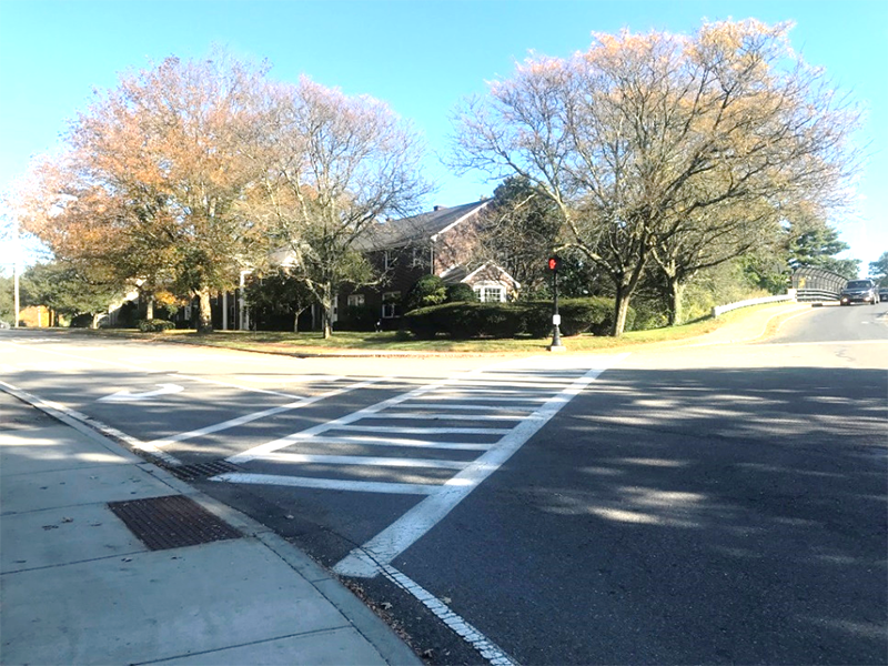 Figure 8 - Southeast Corner of Study Intersection. Image shows multifamily housing, large trees, and a long crosswalk stretching across Linden Street. Figure 8 - Southeast Corner of Study Intersection. Image shows multifamily housing, large trees, and a long crosswalk stretching across Linden Street.